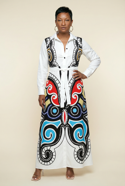 Woman wearing a white blouse with a colorful, patterned skirt on a beige background