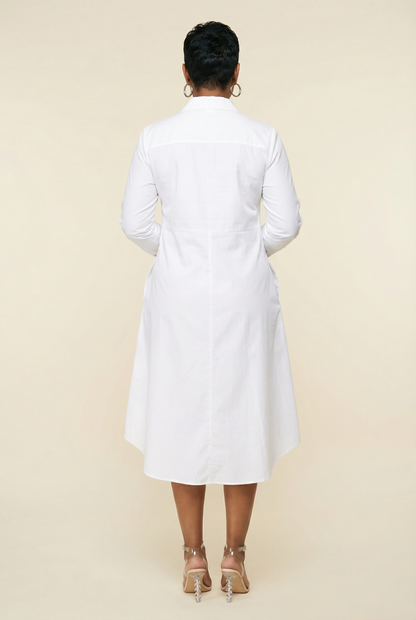 Person wearing a white coat on a beige background