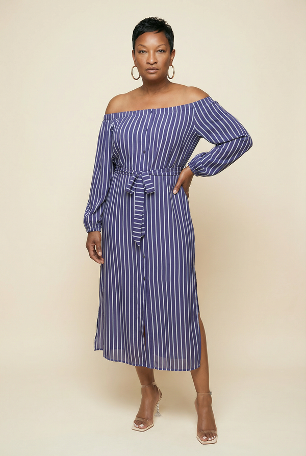 Woman wearing a blue and white striped off-shoulder dress on a beige background