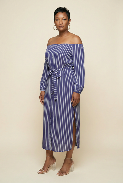 Woman wearing a blue and white striped off-shoulder dress on a beige background